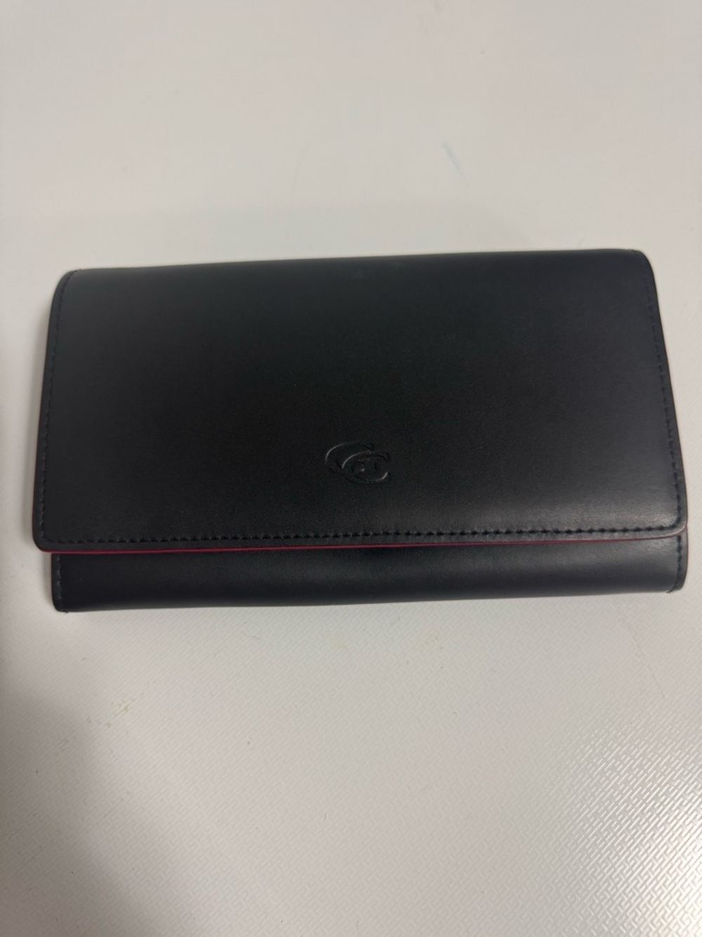 Black Leather Trifold Wallet with Subtle Red Accent
